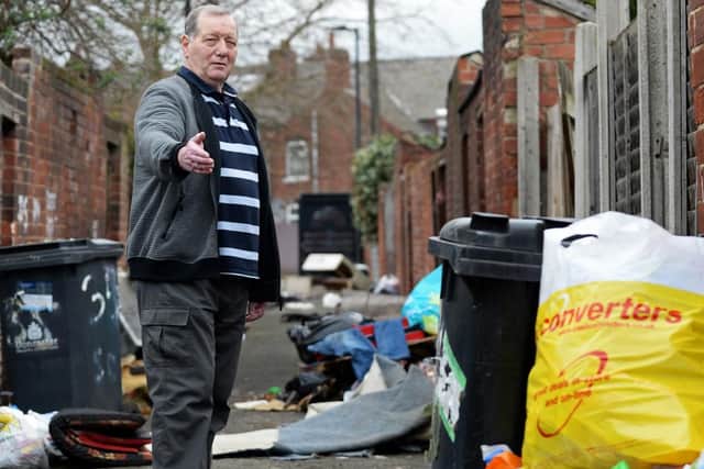 Steve Parsons, pictured, has had enough of the persistent fly-tipping in the backs between Ellerker Avenue and Stone Close Avenue, Hexthorpe. Picture: NDFP-19-03-19-Flytipping-4
