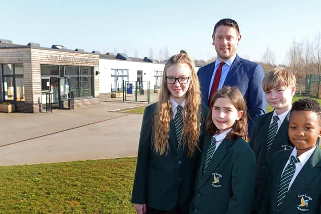 Richard Tuddenham, Carr Lodge Academy Headteacher, pictured with year six children l-r Lily Webster, 11, Eliza Andrianova, ten, Charlie Normansell, 11 and Blessing Dzapasi, 11. Picture: Marie Caley NDFP-26-02-19-CarrLodge-3