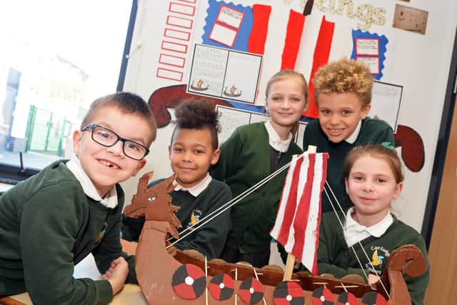 Robbie Nightingale, seven, pictured with his handmade Long Boat and classmates Romeo Echianu, eight, Emma Battersby, eight, Freddie Cooper, eight and Ava Johnsen-Wilson, seven, who have been learning about Vikings in class. Picture: Marie Caley NDFP-26-02-19-CarrLodge-1