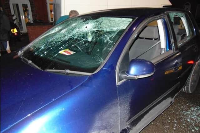 A car was damaged during disorder in a Doncaster street this morning