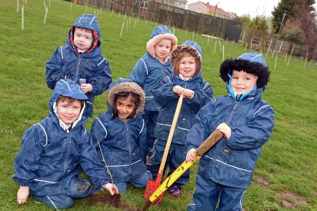 Foundation stage one children, Arthur, Zak, Naz, Lilly, Ellie-May and Alan, pictured, planting Trees. Picture: Marie Caley NDFP-12-03-19-KingfisherTrees-2