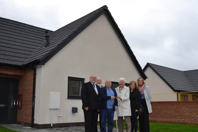 Mayor Ros Jones hands David Coates the keys to his new bungalow in Balby