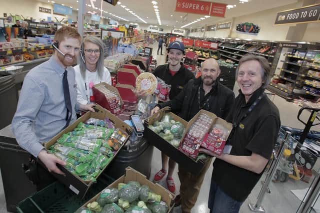 Aldi staff hand over food donations