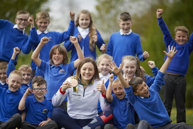 Team GB athlete Katy Marchant giving a talk to the children at Armthorpe Southfield Primary part of ALDI's healthy eating camping and to mark the opening of the new ALDI store in the village.

Picture Katy sat with Charlie Reed aged 6 (glasses) and his school friends