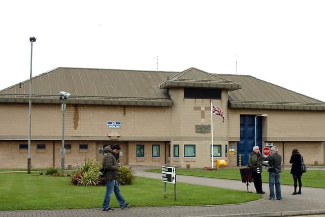 A few media representatives stand around outside HMP Moorland.