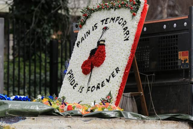 A floral tribute to Tom Bell at his funeral in February this year
