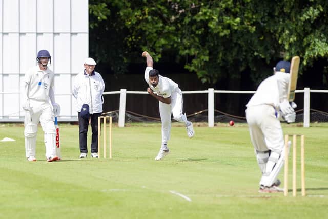 Binura Fernando bowls for Tickhill. James Ward, at the non-striker's end, made a vital 50 for Doncaster.