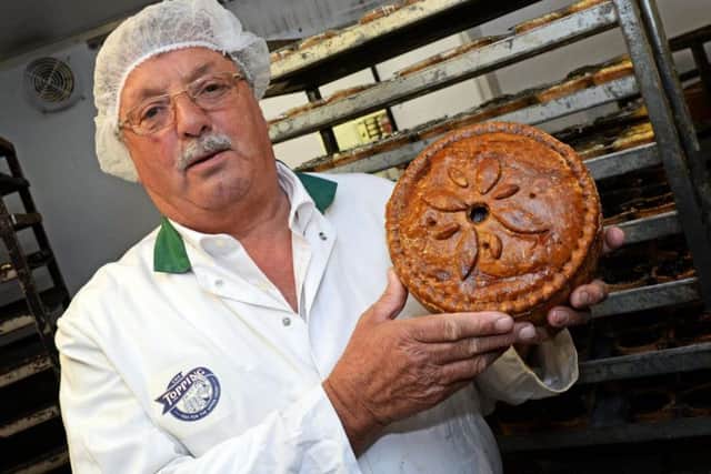 Roger Topping, pictured with a Game Pie.