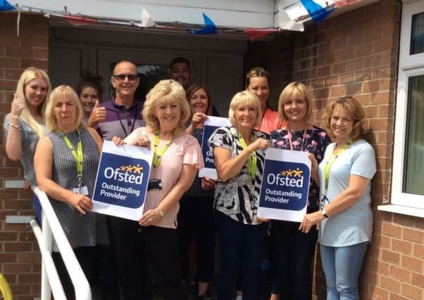 Staff at Oaklands short break home celebrate after receiving an Ofsted outstanding rating
