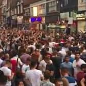Fans celebrate an England win in Silver Street, Doncaster
