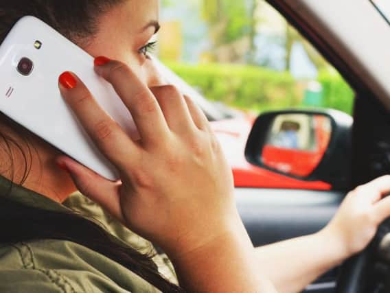 Using a hand-held mobile phone while driving has been illegal in the United Kingdom since 2003
