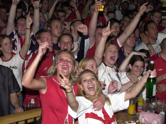 England fans celebrate in Walkabout in 2002.