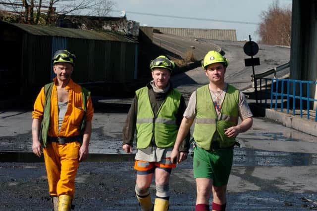 Miners walk to their last production shift at Rossington colliery. L-R John Dowling, Bob Stanard and Andy Harrison. (D0291CB)