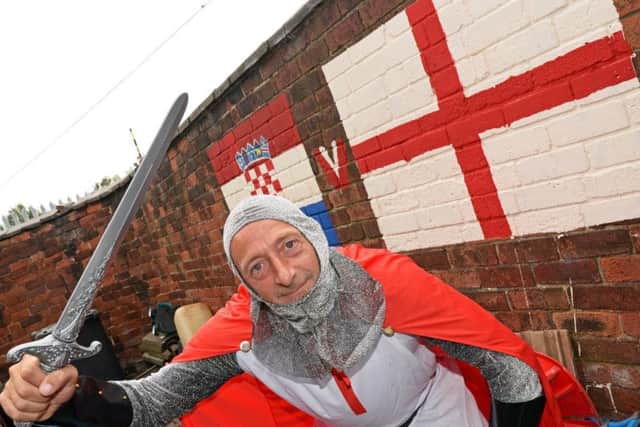 Terry has been decorating his garden wall with England and Croatia flags.