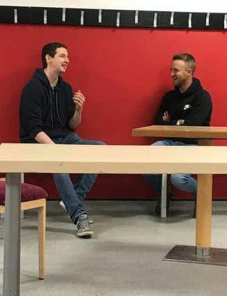 James Coppinger shares a joke with Free Press sports writer Paul Goodwin.