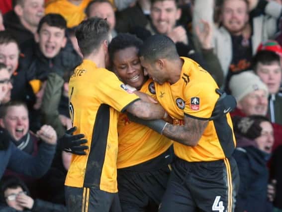 Shawn McCoulsky (centre) celebrates scoring against Leeds United in the FA Cup while on loan at Newport County