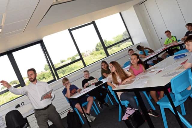 Jamie Portman, Headteacher, pictured taking a Humanities lesson with year nine pupils. Picture: NDFP XP East MC 6  
Byline:  Marie Caley