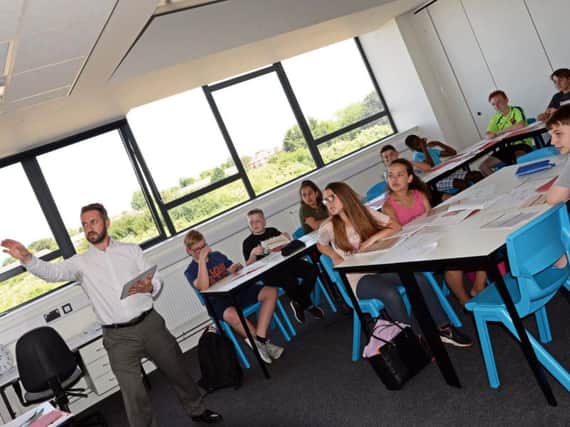 Jamie Portman, Headteacher, pictured taking a Humanities lesson with year nine pupils. Picture: NDFP XP East MC 6  
Byline:  Marie Caley
