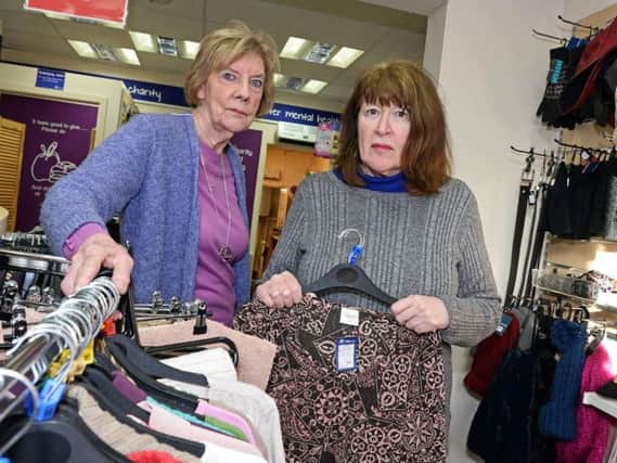 Volunteer Eve Allen and Ann Matthews, Shop Manager, pictured in the Mind charity shop, on Beckett Road. Picture: Marie Caley.