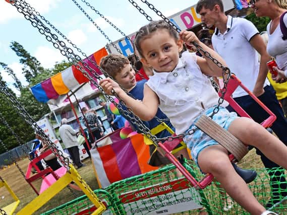 Nikara Steel, two, pictured having fun on the swing ride. Picture: Marie Caley