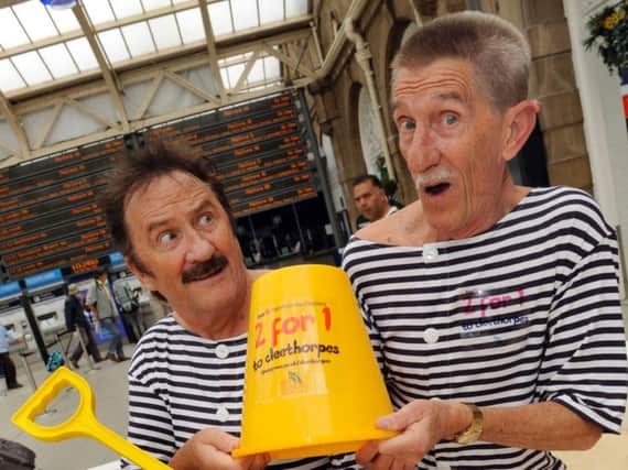 Barry Chuckle, right with his brother Paul Sheffield train station in 2013.
