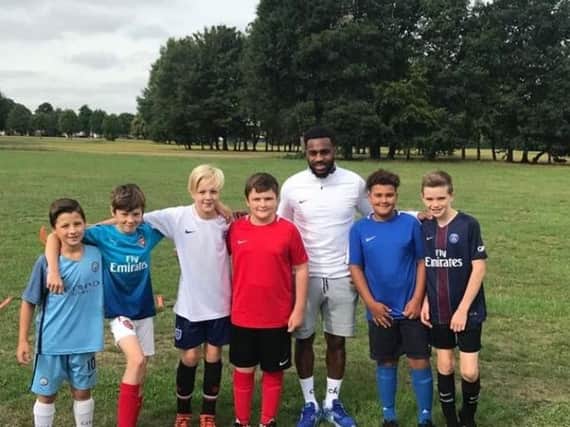 Danny Rose with members of Besscarr U12s FC.