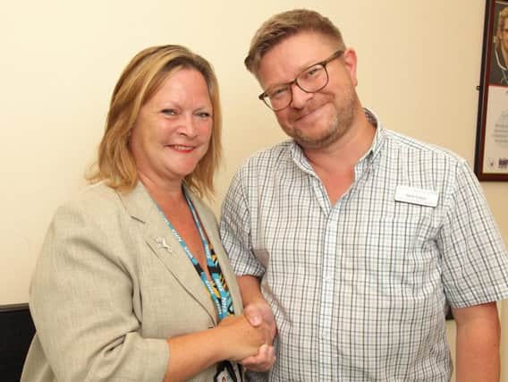 Nick Exley, winner of  Doncaster and Bassetlaw Teaching Hospitals' Star of the Month award, with Suzy Brain England, Chair of the Board at Doncaster and Bassetlaw Teaching Hospitals.