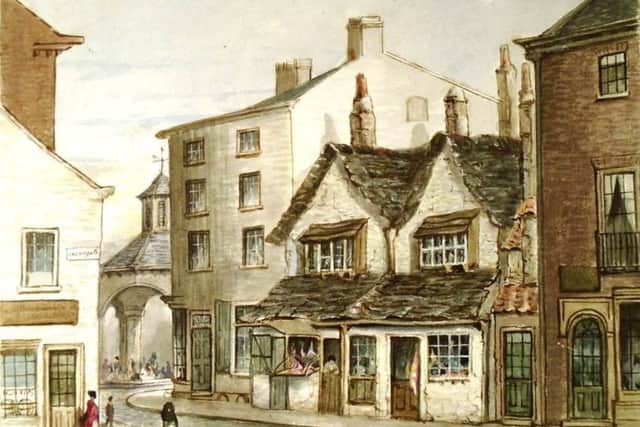 Baxter Gate was the street of bakers in medieval times. In this picture the old house with an extended lower storey is a butchers shop. To the right of it is an elegant new town house built in the latest style