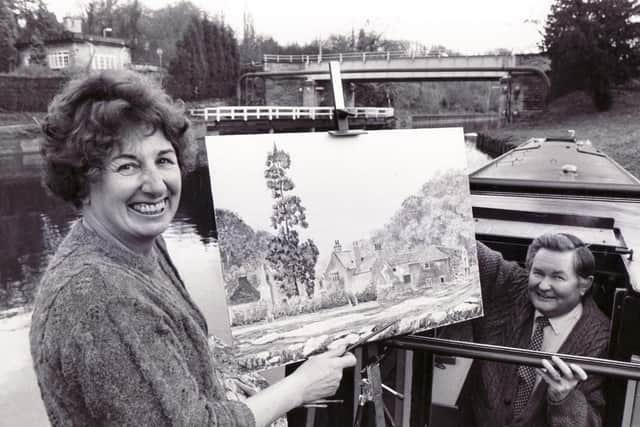Local artist, Sheila Bury, is pictured aboard her narrowboat 'Sprotbro' Painter' with husband Michael Bury in November 1990