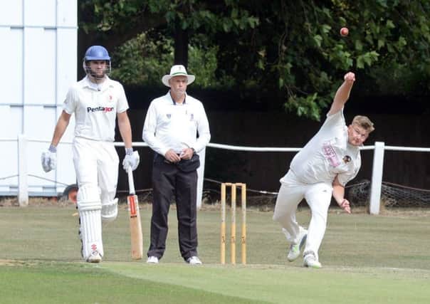 Ben Sommerville is pictured bowling for Conisbrough as Tickhills Michael Jepps watches on. Photos: Marie Caley