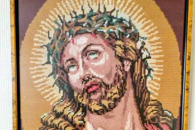Cross-stitched framedportrait Jesus for sale on Facebook marketplace.