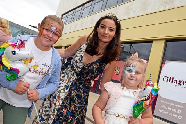 Fran Bishop pictured with Jessica Shorthouse, eight, of Intake and Mia Heath, six, of Carcroft, during the Free Family fun day she organised at Waterdale. Picture: Marie Caley
