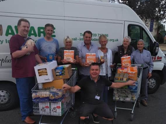 Mexborough Foodbank volunteers with Mexborough Lions members and Foodbank manager Sean Gibbons