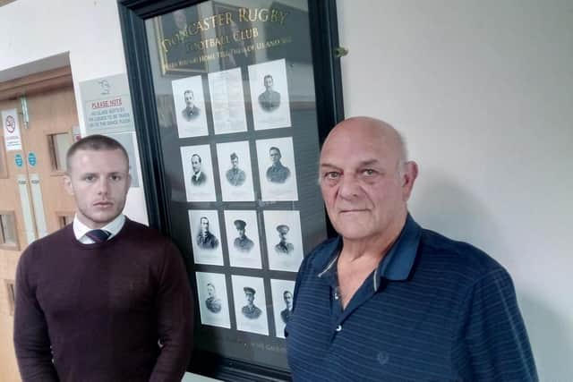 Doncaster Knights and Castle Park commercial manager Michael Casey, left, and former player and army veteran Chris Gryzelka, with the board put up in tribute to Doncaster RUFC players who were killed during World War One. PIcture: David Kessen