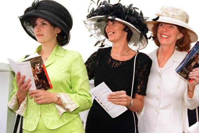 NEWS....
A day at the races......Joanne Allott, of Thurnscoe, Elaine Fearnside, of Scawthorpe, and Sue Davies, of Doncaster, look for a likely winner on Ladies' Day at Doncaster Racecourse, yesterday (11 Sept).