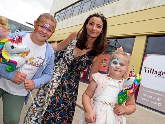 Apprentice Star and local business woman Fran Bishop pictured with Jessica Shorthouse, eight, of Intake and Mia Heath, six, of Carcroft, during the Free Family fun day she organised at Waterdale. Picture: Marie Caley