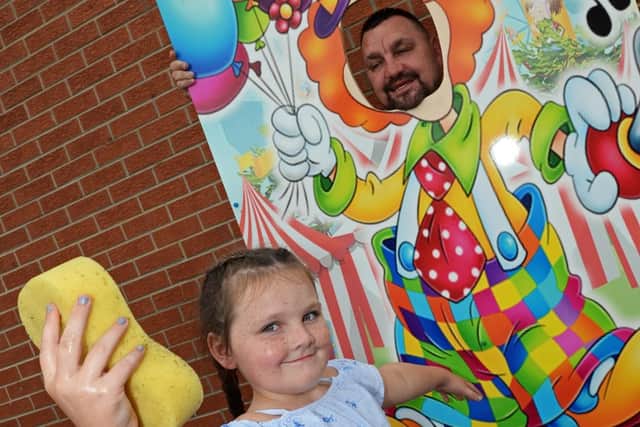 Myla Mae's sister Macie Carte, eight, soaks her dad Trev Carte, during the event. Picture: Marie Caley NDFP-18-08-18-MylaFundraiser-5