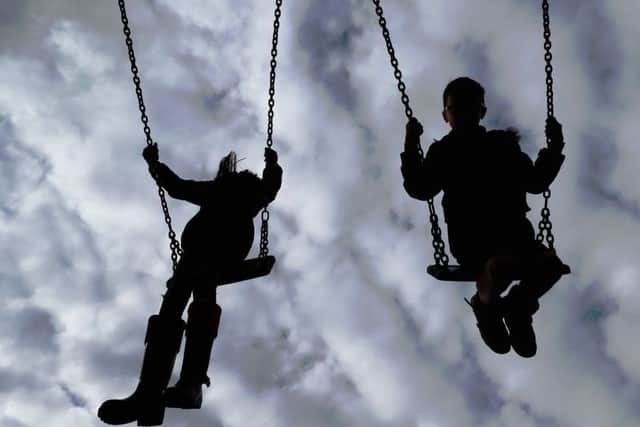 Embargoed to 0001 Tuesday September 18 File photo dated 4/3/2017 of Children playing on swings. Children are most exposed to dangerous air pollution on the school run and while they are out in the playground, experts have warned.