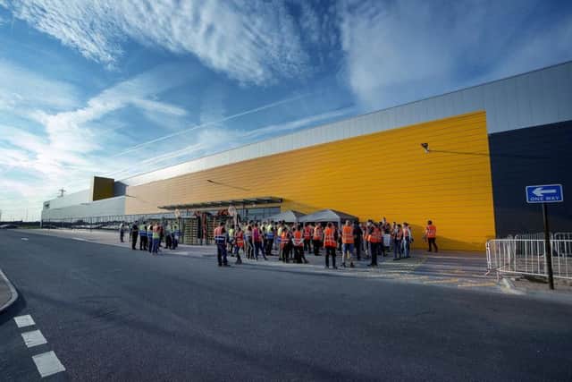 Amazon raises minimum wage for workers and reveals plans to hire 20,000 ...