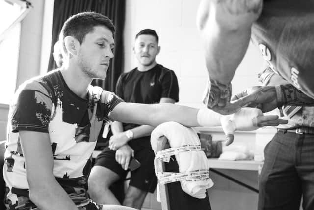 Watched on by twin brother Jamie McDonnell, Gavin McDonnell gets his hands wrapped