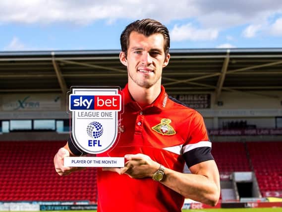 John Marquis with his League One player of the month award