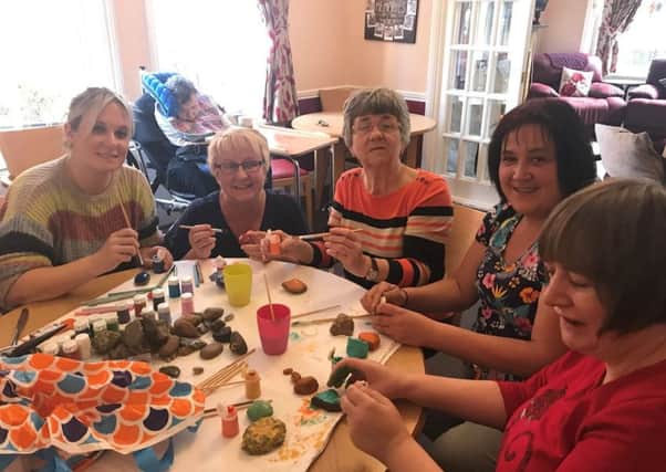 Residents and staff painting kindness rocks at RMBI Home Harry Priestley House. Left to Right: Hayley Rollason, Anne Stobart, Lynne Johnson, Kelly Teale, Sarah Moulson.