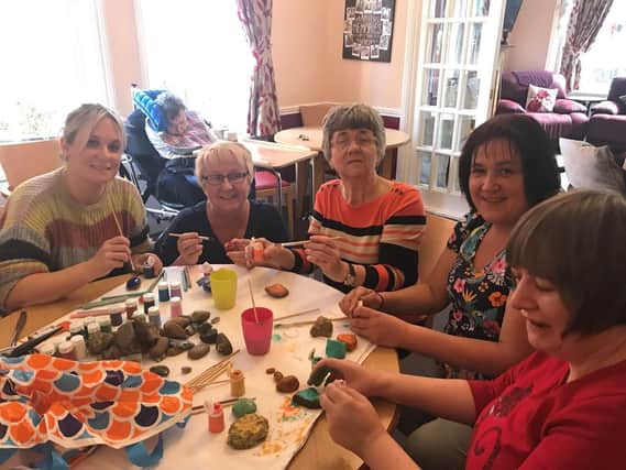 Residents and staff painting kindness rocks at RMBI Home Harry Priestley House - (From left) Hayley Rollason, Anne Stobart, Lynne Johnson, Kelly Teale, Sarah Moulson