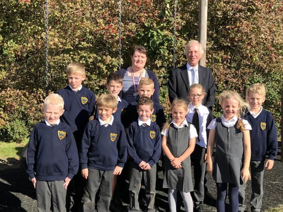 Westwoodside Church of England Primary Academy head teacher, June Richardson and Coun David Rose with school children