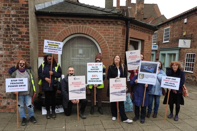 Frack Free Isle campaigners wearing gags staged a protest outside Isle MP Andrew Percys office in Brigg