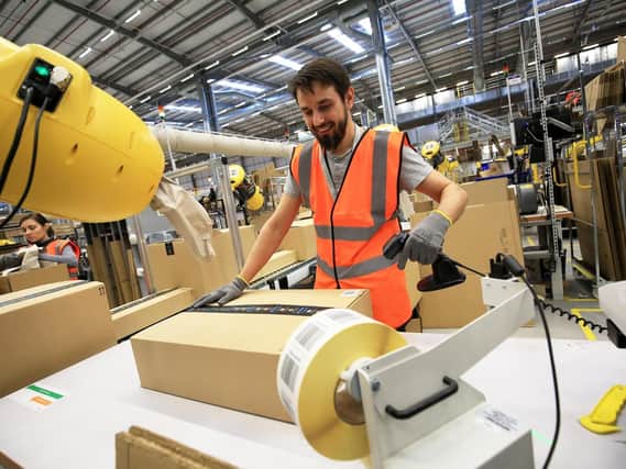 Items are packed and are ready to be sent to the customer at an Amazon fulfilment centre. Picture: Chris Etchells