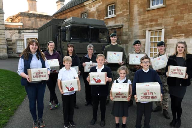 Soldiers arrive at Cusworth Hall Museumin Doncaster to collect comfort packs from Sandringham Primary School pupils, for soldiers in the Middle East. They have been made in the style of those sent during WW1 a century ago. 
19th October 2018.