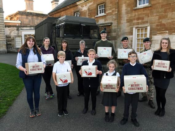 Soldiers arrive at Cusworth Hall Museumin Doncaster to collect comfort packs from Sandringham Primary School pupils, for soldiers in the Middle East. They have been made in the style of those sent during WW1 a century ago. 
19th October 2018.