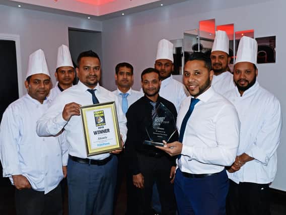 Curry House of the Year 2018 winners Shimla, in Armthorpe. Raf Ali, manager and Sheb Miah, owner, pictured with staff members. Picture: Marie Caley NDFP-03-11-18-CurryHouseShimla-1