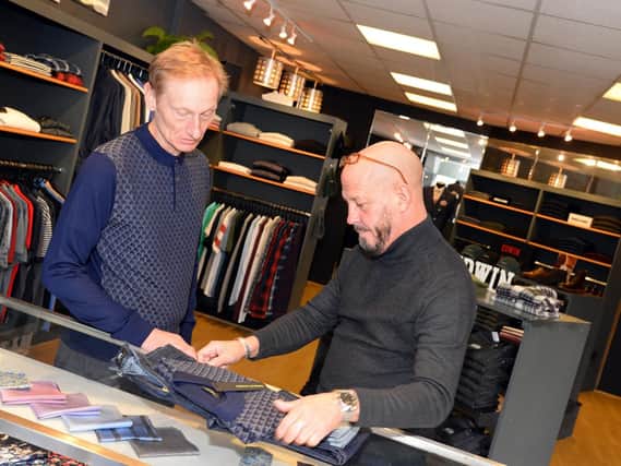 Phil Elvin, pictured with a customer at Punch Menswear. Picture: Marie Caley NDFP-23-10-18-Punch-2